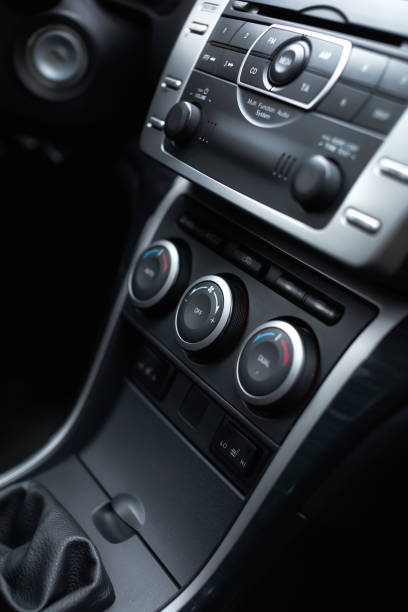 Car climate control panel for driver and passenger with shallow depth of field close up. stock photo