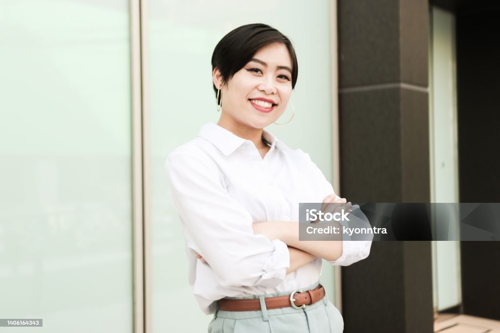 Portrait of Asian businesswoman with smile Generation Z: Asian woman looking at camera in outdoors Beautiful Woman Stock Photo