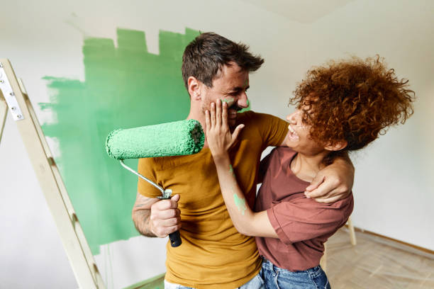 istock Let me put a bit of paint on your face honey! 1406164741