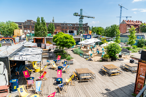 Gdansk shipyard district - 100cznia and its visitors. 100cznia is a project aimed at renovation of old facilities and historic buildings and turning them into a modern multifunctional creative space.