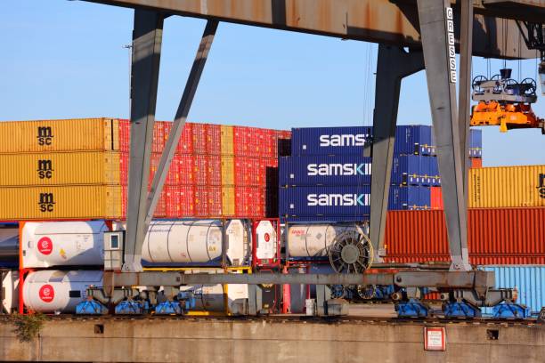 Shipping containers of MSC and Samskip and tank containers in Port of Duisburg, Germany. Port of Duisburg is the largest inland port in the world.