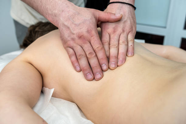 istock young slim woman having relaxing massage on back in spa 1406175662