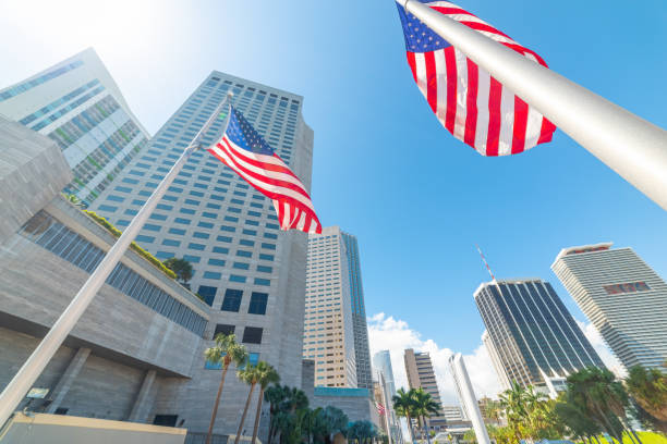 istock Skyscrapers and US flags in downtown Miami under a shining sun 1406176024