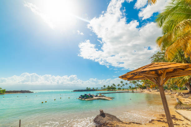 istock Sun shining over beautiful Bas du Fort beach in Guadeloupe 1406177537