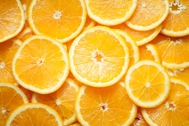 istock Close up image of orange slices. Orange background. 1406177571