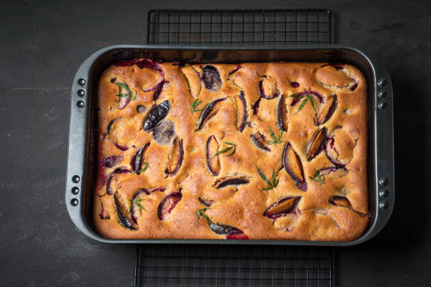 istock Baked cake with plums and marijuana leaf 1406179087