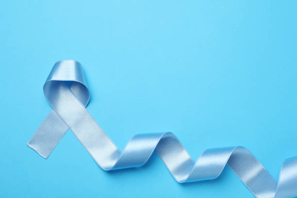 istock Light blue awareness ribbon on color background, top view. Space for text 1406181423