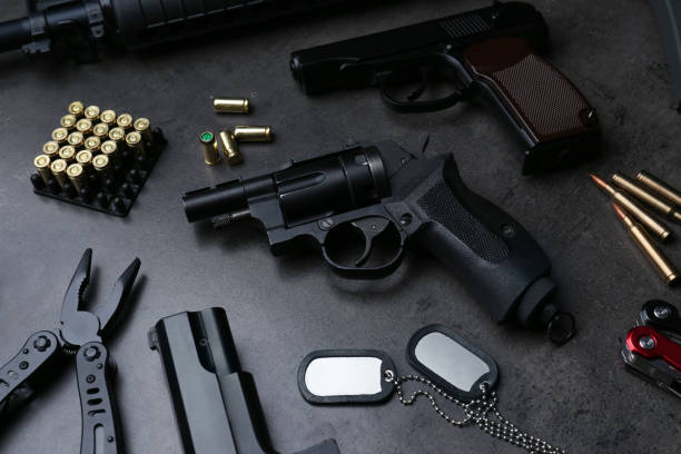 istock Composition with professional guns on black background, above view 1406182148