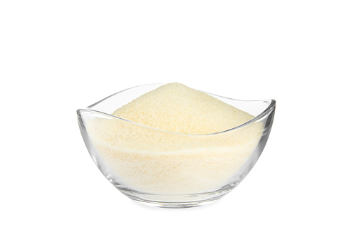 Gelatin powder in glass bowl isolated on white