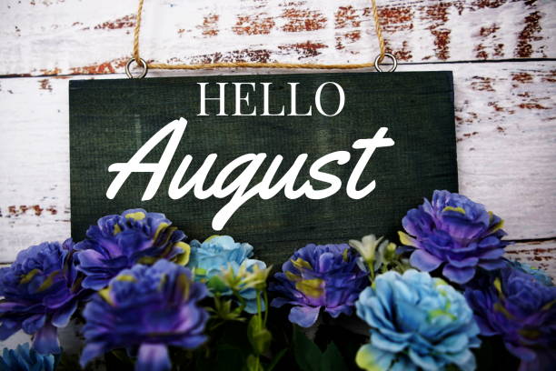 istock Hello August typography text decorate with flower on wooden background 1406183815