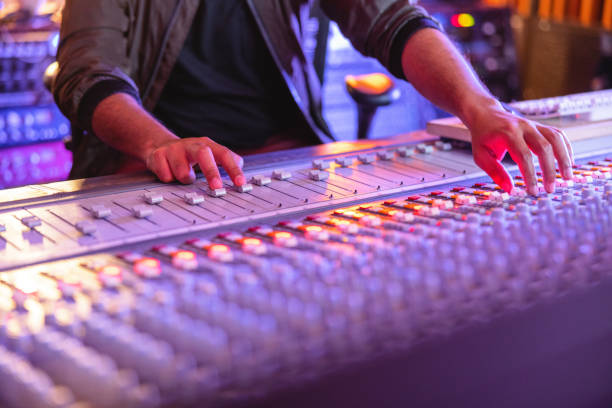 close up of a producer working in studio - computer keyboard audio imagens e fotografias de stock