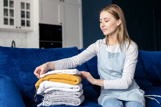 istock Woman in apron puts things in cozy room 1406185925