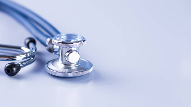 istock Medical concept image. Stethoscope on white background close up.A lot copy space around the product.Blue stethoscope.Healthcare. 1406187084