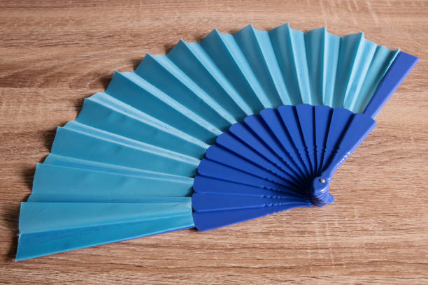 istock A blue fan from Spain on wooden background 1406188296
