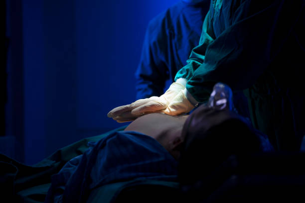 istock Doctors are surgery to patient at operating room. 1406188331