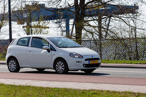 Mulhouse - France - 20 April 2021 - Profile view of white Toyota Yaris parked in the street