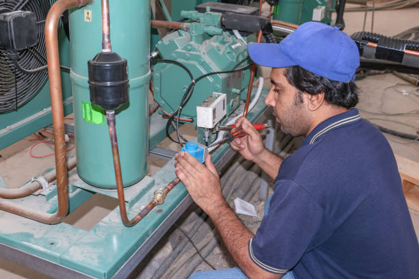 istock a Professional electrician Repairing an air conditioner compressor 1406188938