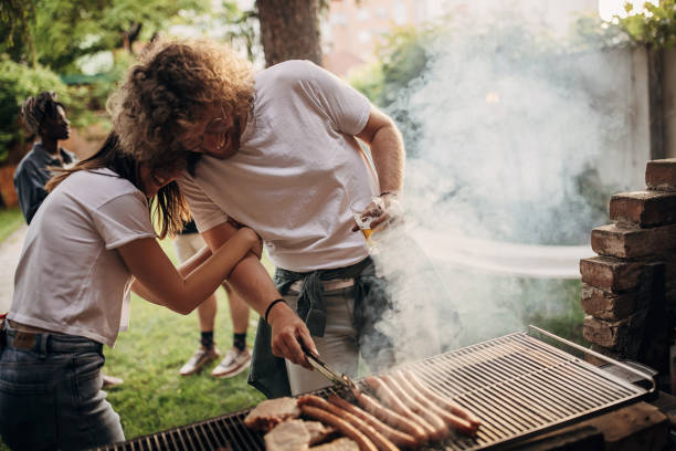 istock Couple on barbecue party 1406189643