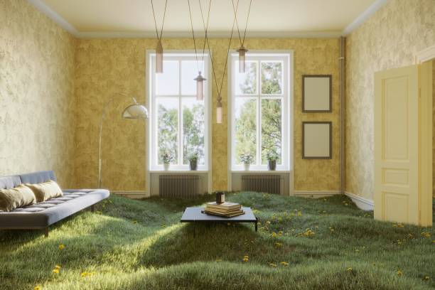 Living room with grass A surreal scene includes a green living room covered grass and flowers with furnitures and yellow wallpaper. (3d render) green home decor stock pictures, royalty-free photos & images