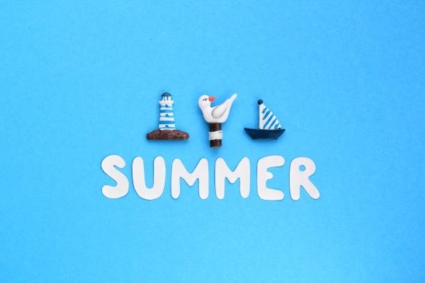 istock Composition of lighthouse, gull, ship figures and lettering Summer on blue background 1406190888
