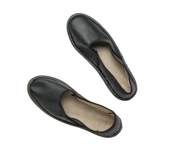 istock Top view of black leather work slippers isolated on a white background. 1406191354