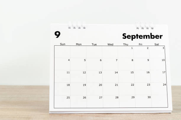 istock September 2022 desk calendar on wooden background. 1406203629