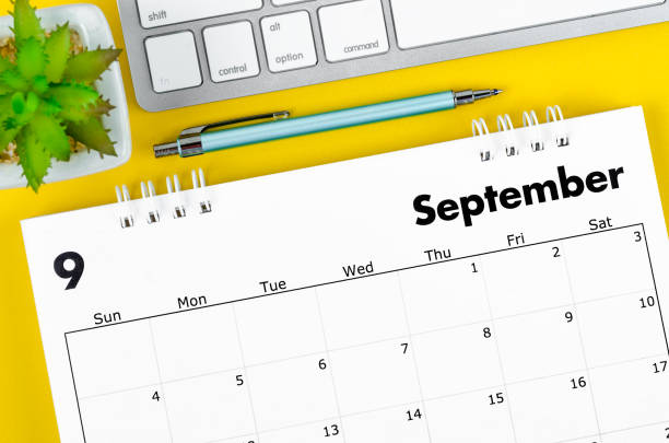 istock September 2022 desk calendar with pen and keyboard computer on yellow background. 1406203633