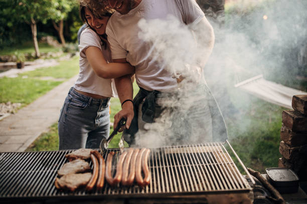 istock Couple on barbecue party 1406205022