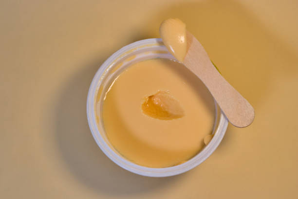 istock Mango yogurt scooped from yogurt cup with wooden spoon 1406205652