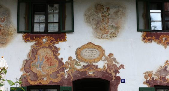 Oberramergau, bavaria, germany, 01 june, 2022, Mural paintings on houses facades in the streets of the village, by various anonymous artists, 19th century