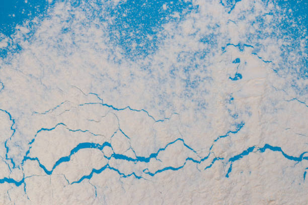 frozen earth aerial view, creative minimal design, global warming, melting ice at the poles, creative art design