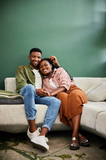 istock Affectionate young couple relaxing on their living room sofa 1406208016