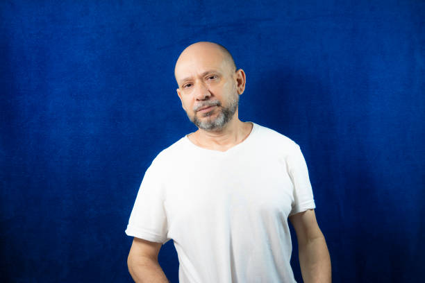istock Portrait of a bearded man against a blue background. 1406208230