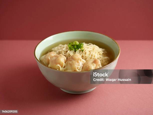 Signature Canton Jumbo Prawn Wanton Noodle With Chopsticks Served In A Bowl Isolated On Mat Side View On Grey Background Stock Photo - Download Image Now