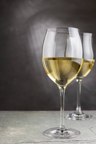 istock Glass of white wine on the table. 1406209217