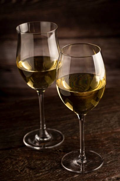 istock Glass of white wine on the table. 1406209335