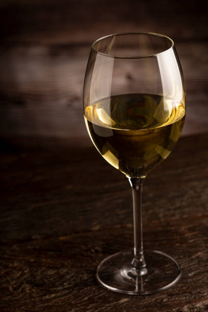 istock Glass of white wine on the table. 1406209338