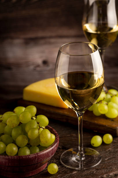 istock Glass of white wine on the table. 1406209355
