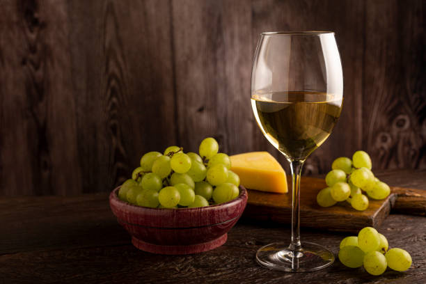 istock Glass of white wine on the table. 1406209383