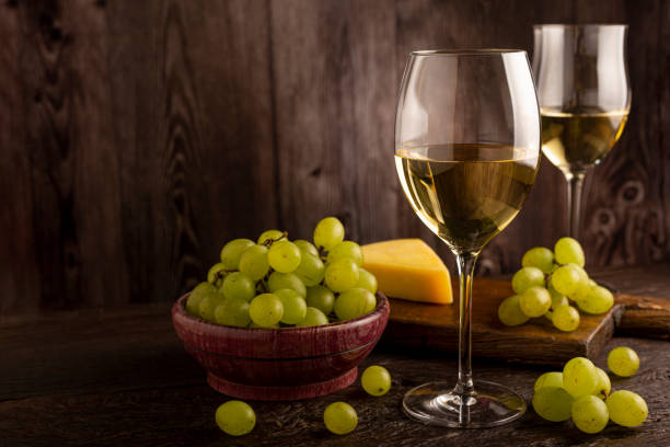 istock Glass of white wine on the table. 1406209391