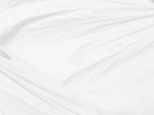 istock fashion textile white Clean woven beautiful soft fabric abstract smooth curve shape decorative background 1406213705
