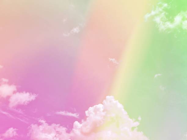 istock beauty sweet pastel green purple colorful with fluffy clouds on sky. multi color rainbow image. abstract fantasy growing lights 1406213708