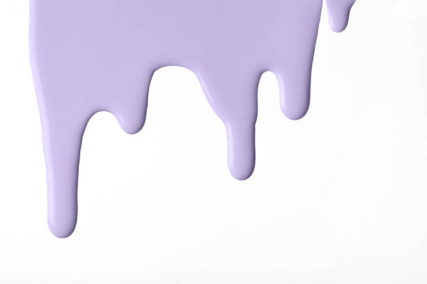 istock Light purple liquid drops of paint color flow down on isolated white background. Abstract violet backdrop 1406214362