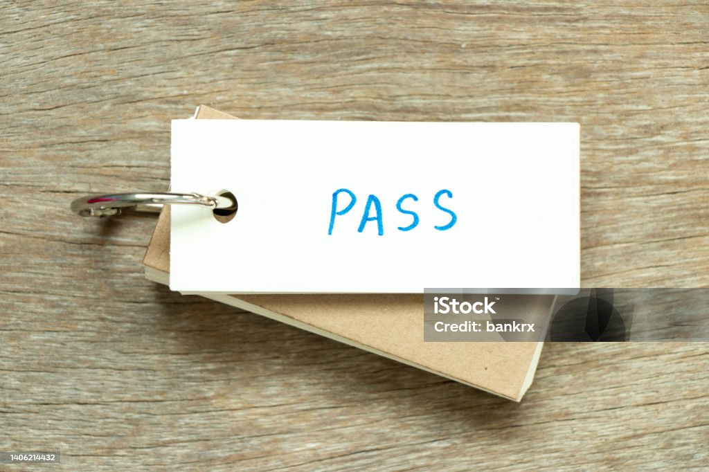 Flash card with handwriting word pass on wood background Agreement Stock Photo