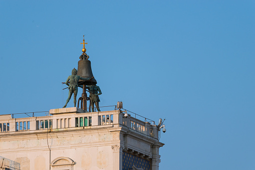 Venice, Italy - September 24, 2021: The “Moors” striking the hours at the top of St. Mark's Clocktower. On a terrace at the top of the tower are two great bronze figures which strike the hours on a bell. One is old and the other young, to show the passing of time. They are known as \
