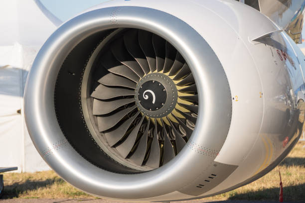 istock Commercial aircraft engine under the wing in a parking lot. 1406218290