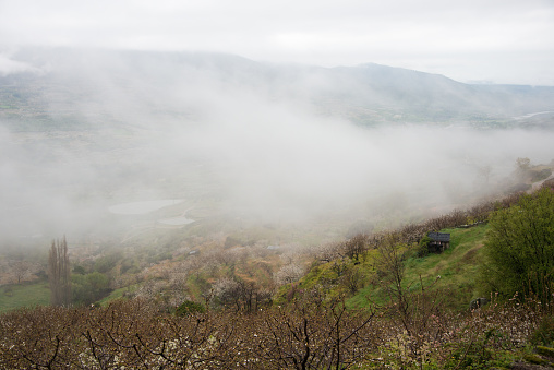 View of a beautiful foggy valley . Caceres