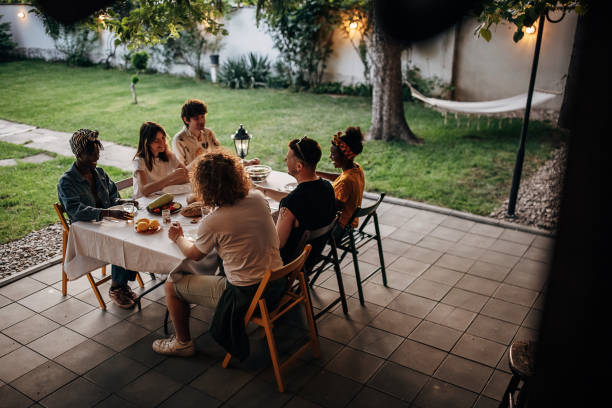 istock Friends on garden party in back yard 1406219273
