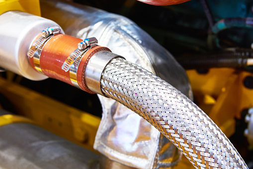 Reinforced metal hose pipe and clamp industrial engine