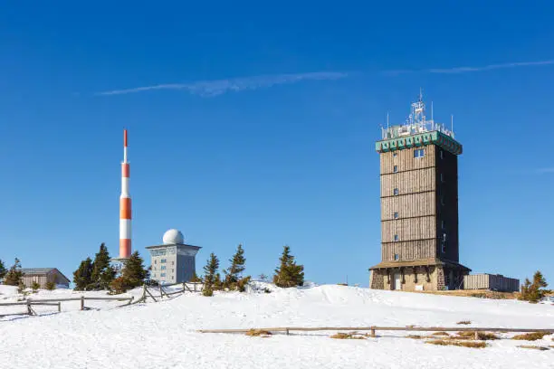 Brocken mountain peak summit in Harz with snow in winter in Germany